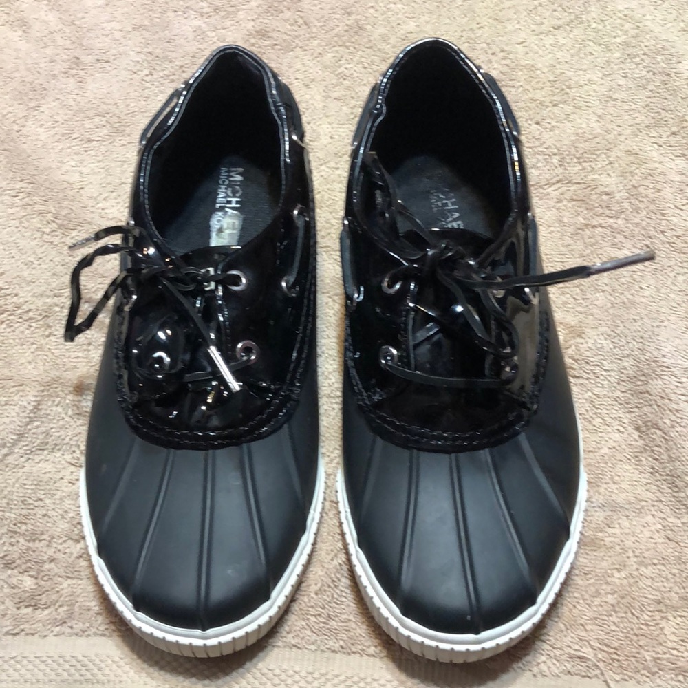 Michael Kors rain shoes.  Size 9.  Black and white rubber.  Lots of life left.